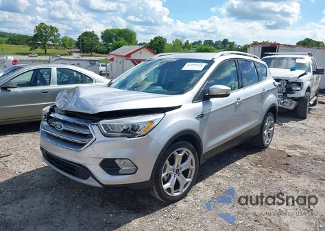 2017 Ford Escape Titanium z USA, uszkodzony, nr VIN 1FMCU9J93HUE43374